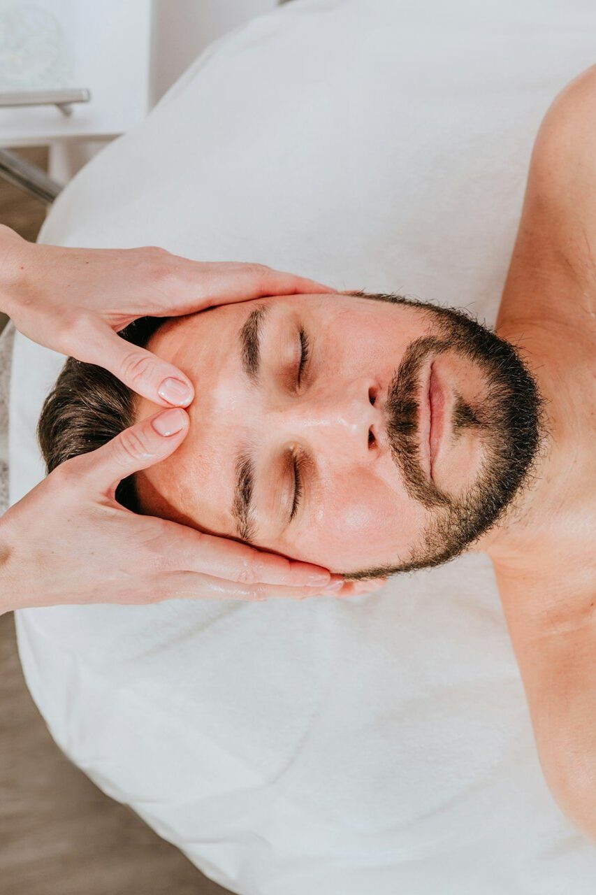 Man receiving a relaxing facial massage