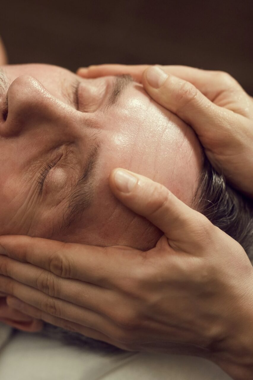 Senior Man Enjoying Facial Massage in SPA